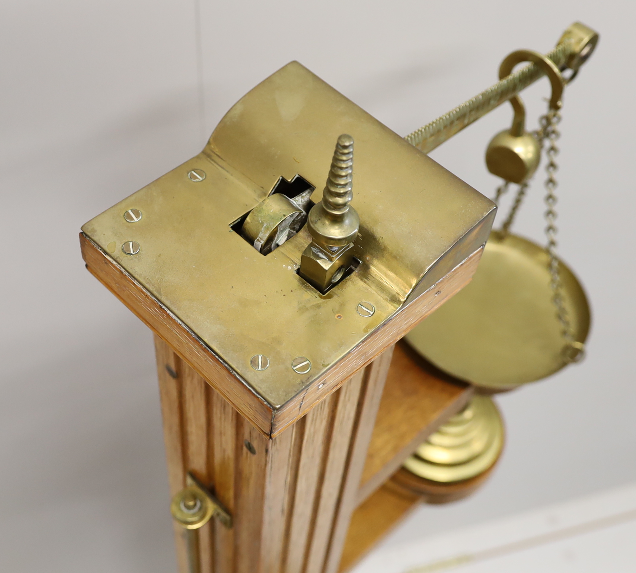 A Youngs of Bear St. London Victorian brass mounted oak personal weighing scales with incorporated height measuring stick, oak body and platform and set of five weights, 122cm